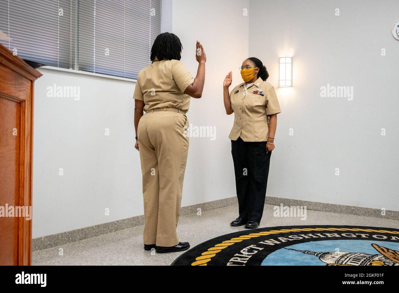 WASHINGTON, DC (April 2, 2021) – Culinary Specialist 2nd Class Sheniqua Lee recites the oath of enlistment during a ceremony onboard Washington Navy Yard. Stock Photo