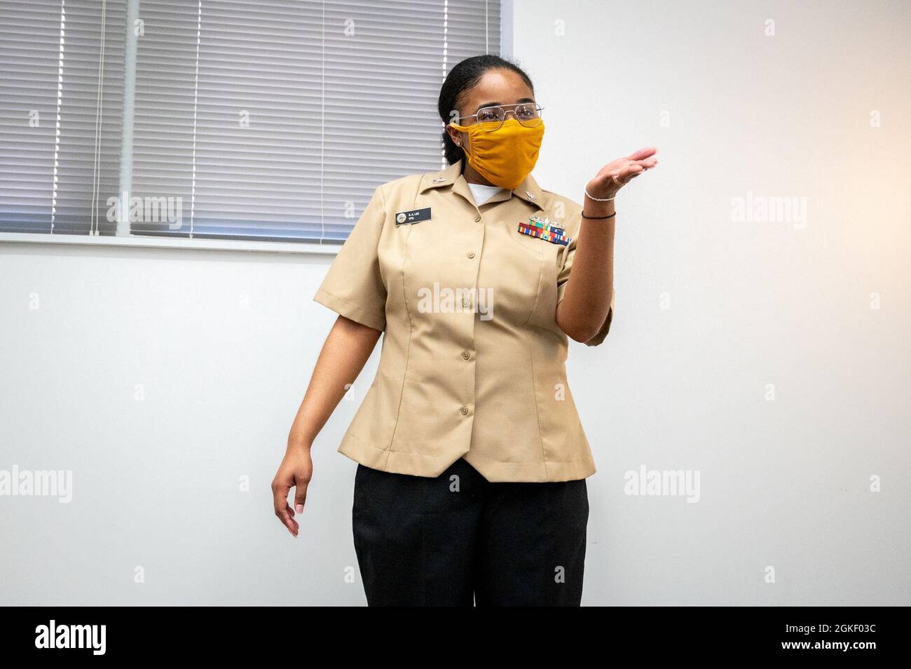 WASHINGTON, DC (April 2, 2021) – Culinary Specialist 2nd Class Sheniqua Lee addresses her colleagues and friends during her reenlistment ceremony held onboard Washington Navy Yard. Stock Photo