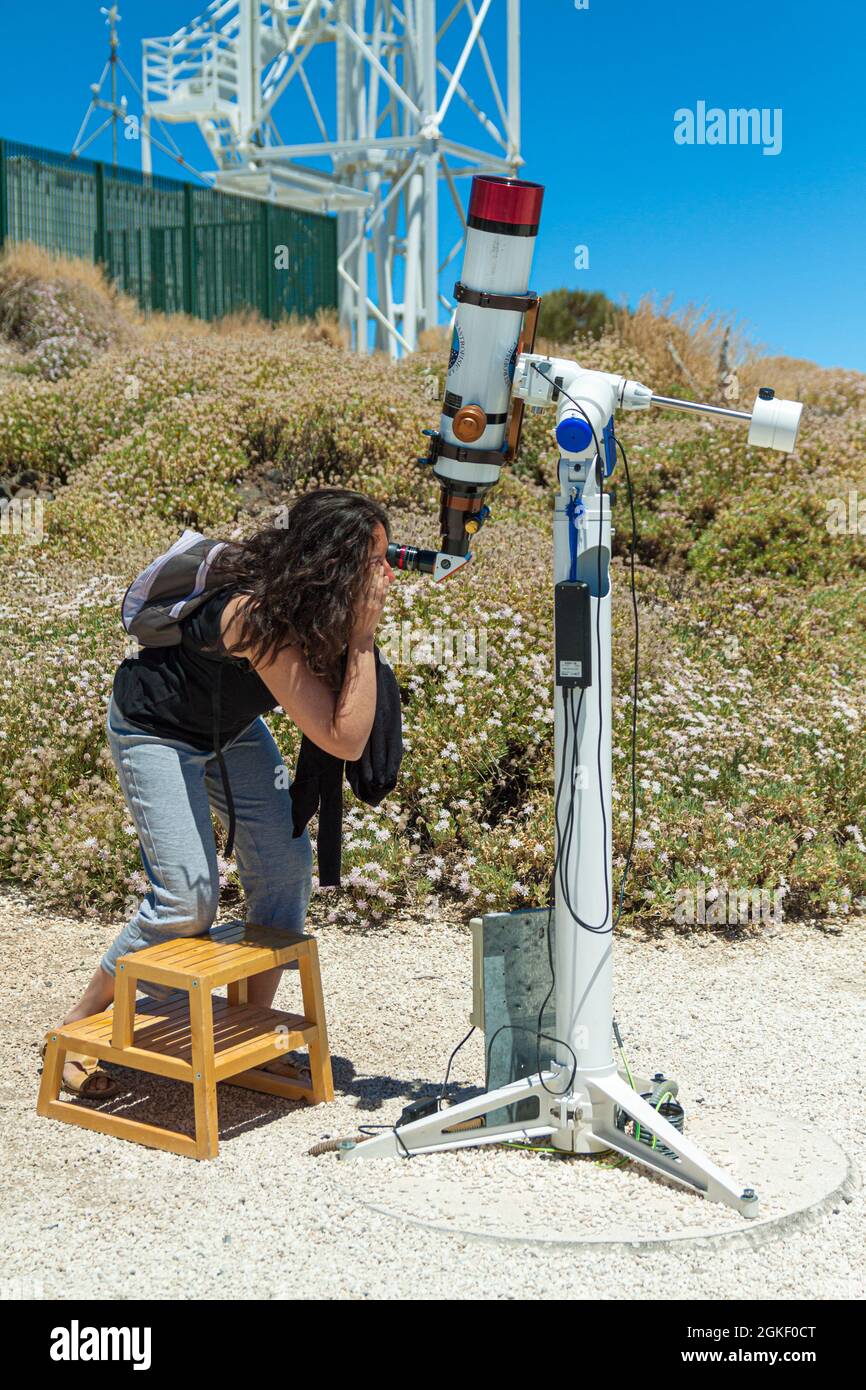 Tenerife, Spain; July 31st 2015: Girl viewing the sun with a telescope. Institute of Astrophysics of the Canary Islands, Teide observatory. Stock Photo