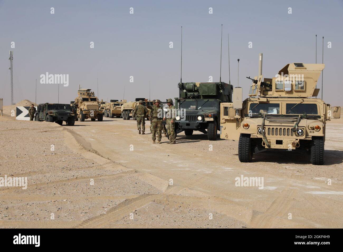 U.S. Army Task Force Iron Valor vehicles are waiting to conduct field operations during a validation exercise at Udairi Range Complex, Kuwait, on April 22, 2021. Soldiers from the 1-181 Field Artillery Regiment and Delta Company 3-172 Infantry-Mountain, make up Task Force Iron Valor. Stock Photo