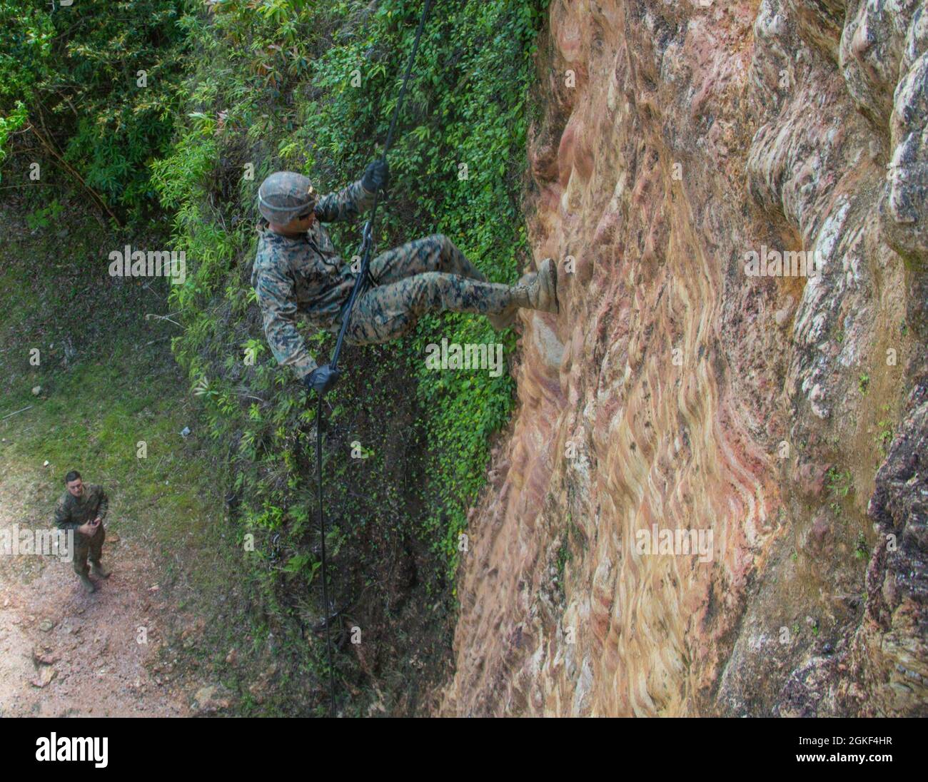 U.S. Marine Corps Lance Cpl. Cameron a field artillery fire