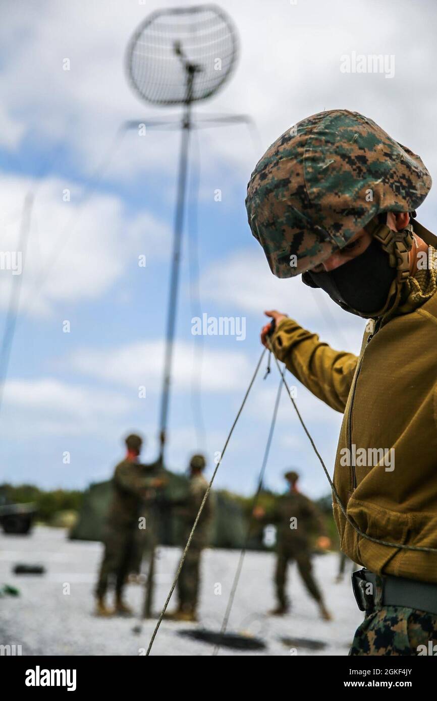 U.S. Marine Corps Cpl. Kevin Guerrero, transmissions system operator with 3d Supply Bn, secures