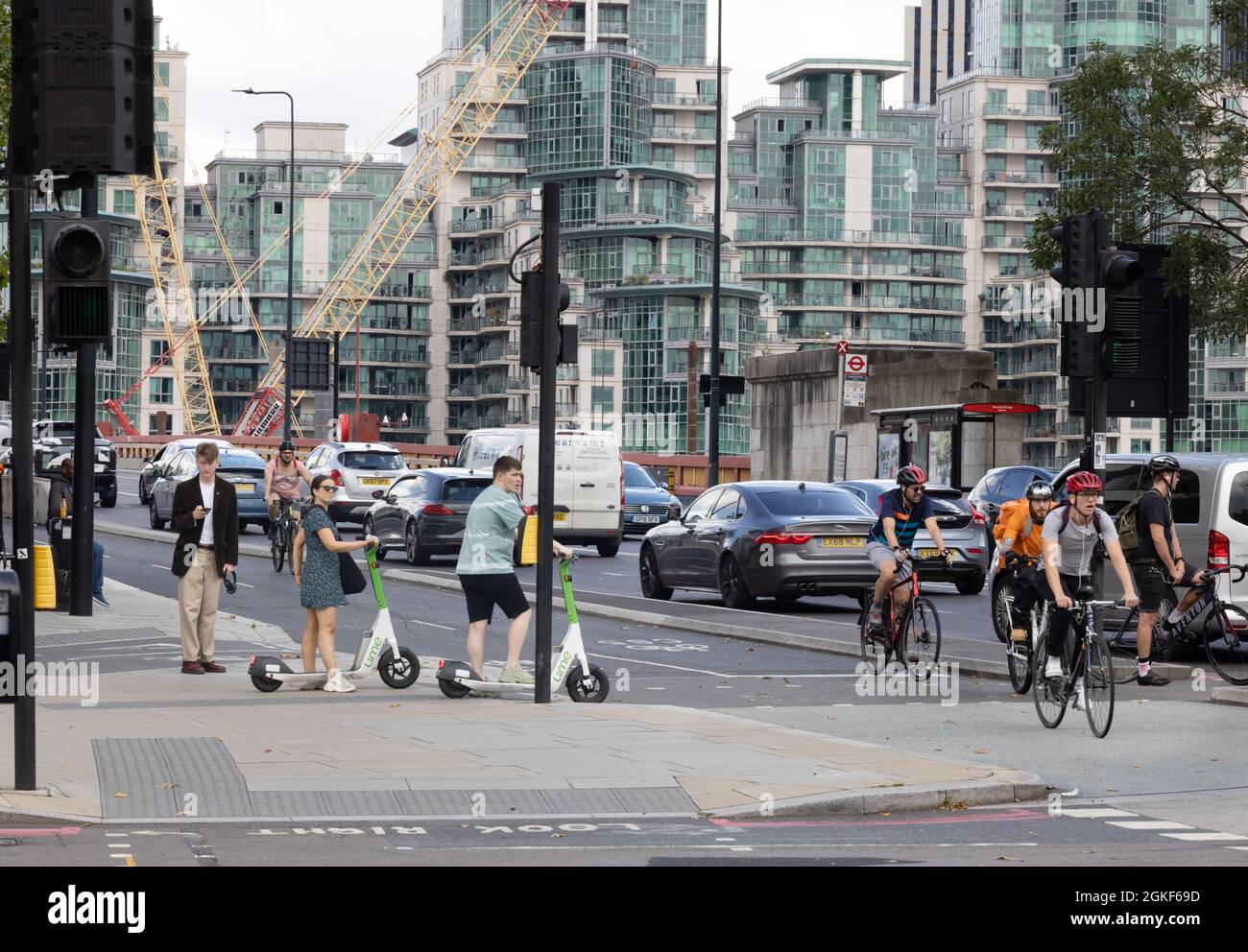 City life UK; London Street scene London SW1; Cyclists, scooter riders, cars and traffic  on Vauxhall Bridge Road, Pimlico London UK Stock Photo