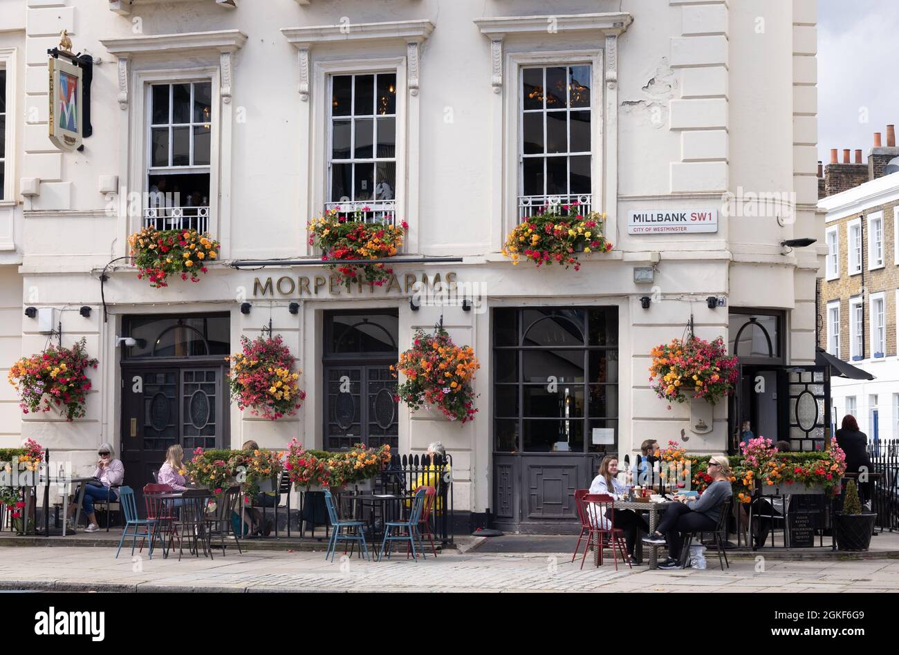 London pub; people sitting drinking outside The Morpeth Arms in summer,  Millbank London SW1, Pimlico, London UK Stock Photo