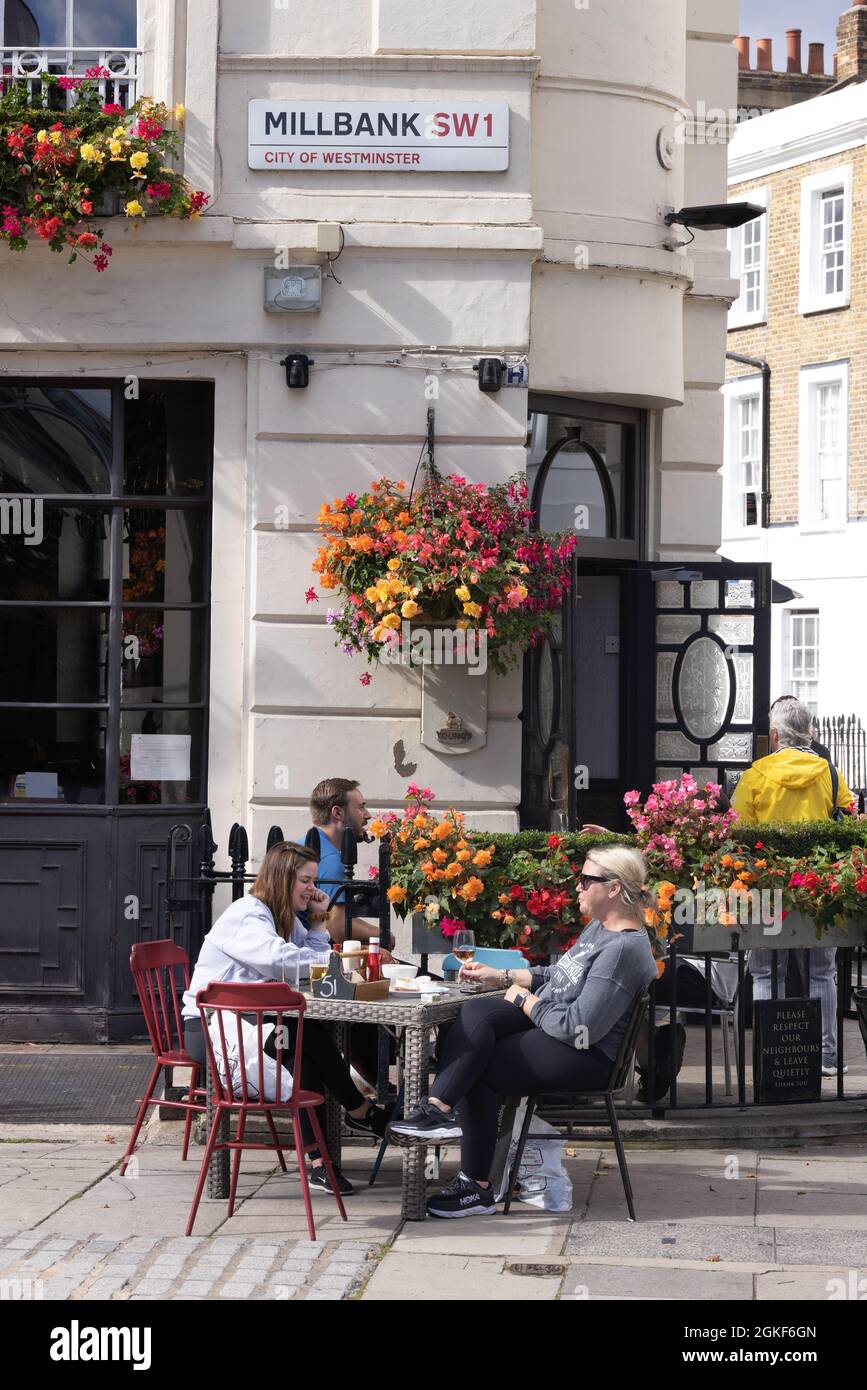 London pub; people sitting drinking outside The Morpeth Arms in summer,  Millbank London SW1, Pimlico, London UK Stock Photo