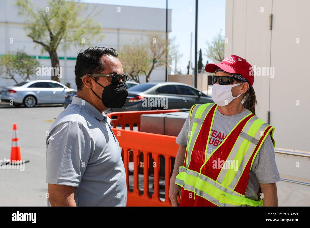 Dottie Swails (right) a volunteer with Team Rubicon speaks with Health and  Human Services Director Fabian Solis about the patient waiting area at the  mobile vaccination unit site, Tuesday, April 6, 2021