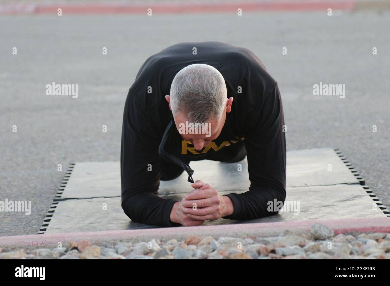 32d AAMDC commanding general, Brig. Gen. Dave Stewart, holds the plank position during ACFT focused circuit training here at Fort Bliss, Texas. Stock Photo