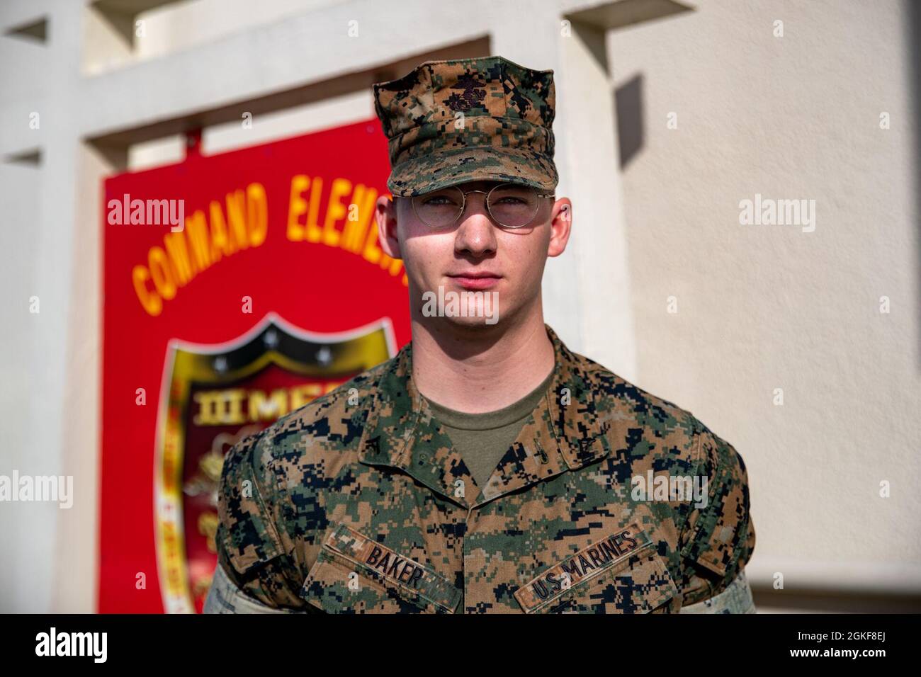 U.S. Marine Corps Lance Cpl. Benjamin Baker, a data systems administrator with III Marine Expeditionary Force, poses for a portrait on Camp Courtney, Okinawa, Japan, April 7, 2021. Stock Photo