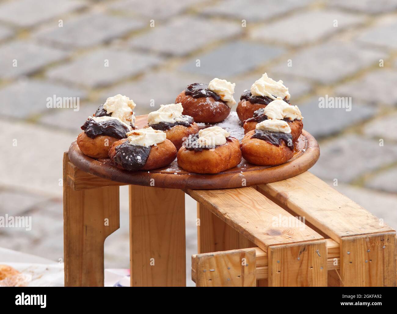 A vendor at a stall on the Naplavka farmers street food market offers