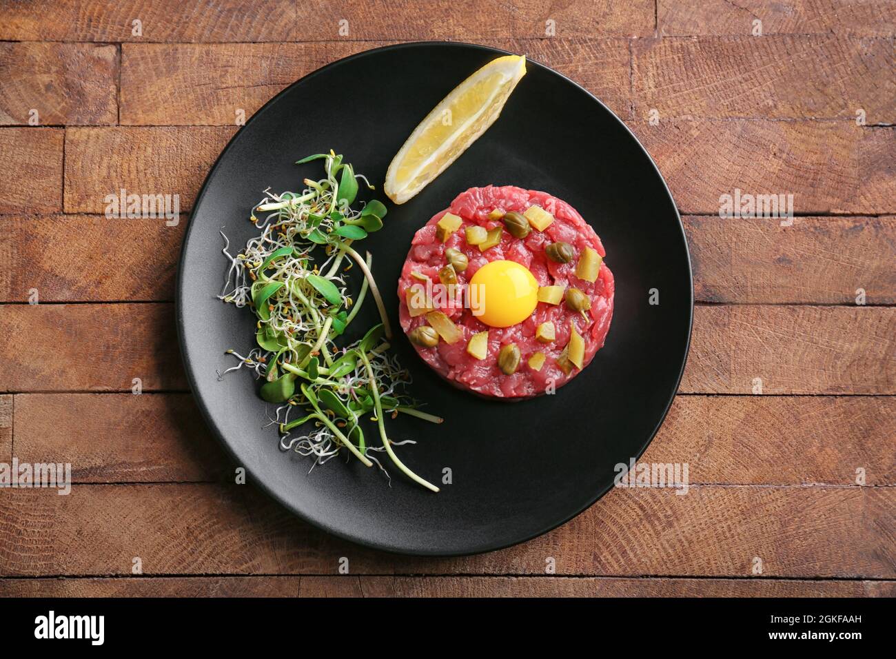 Delicious steak tartare with yolk on plate Stock Photo Alamy
