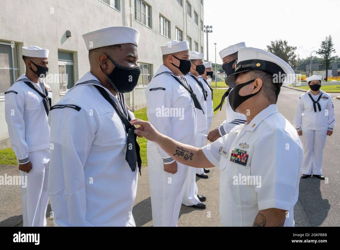 Camp Shields Japan Apr 8 21 Senior Chief Culinary Specialist Edwin Munoz Commander Fleet Activities Okinawa Unaccompanied Housing Manager Conducts A Dress Whites Inspection Of Unaccompanied Housing Personnel At Camp Shields Okinawa