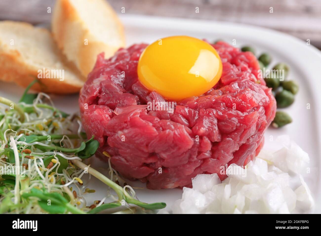 Delicious steak tartare with yolk on plate, closeup Stock Photo Alamy