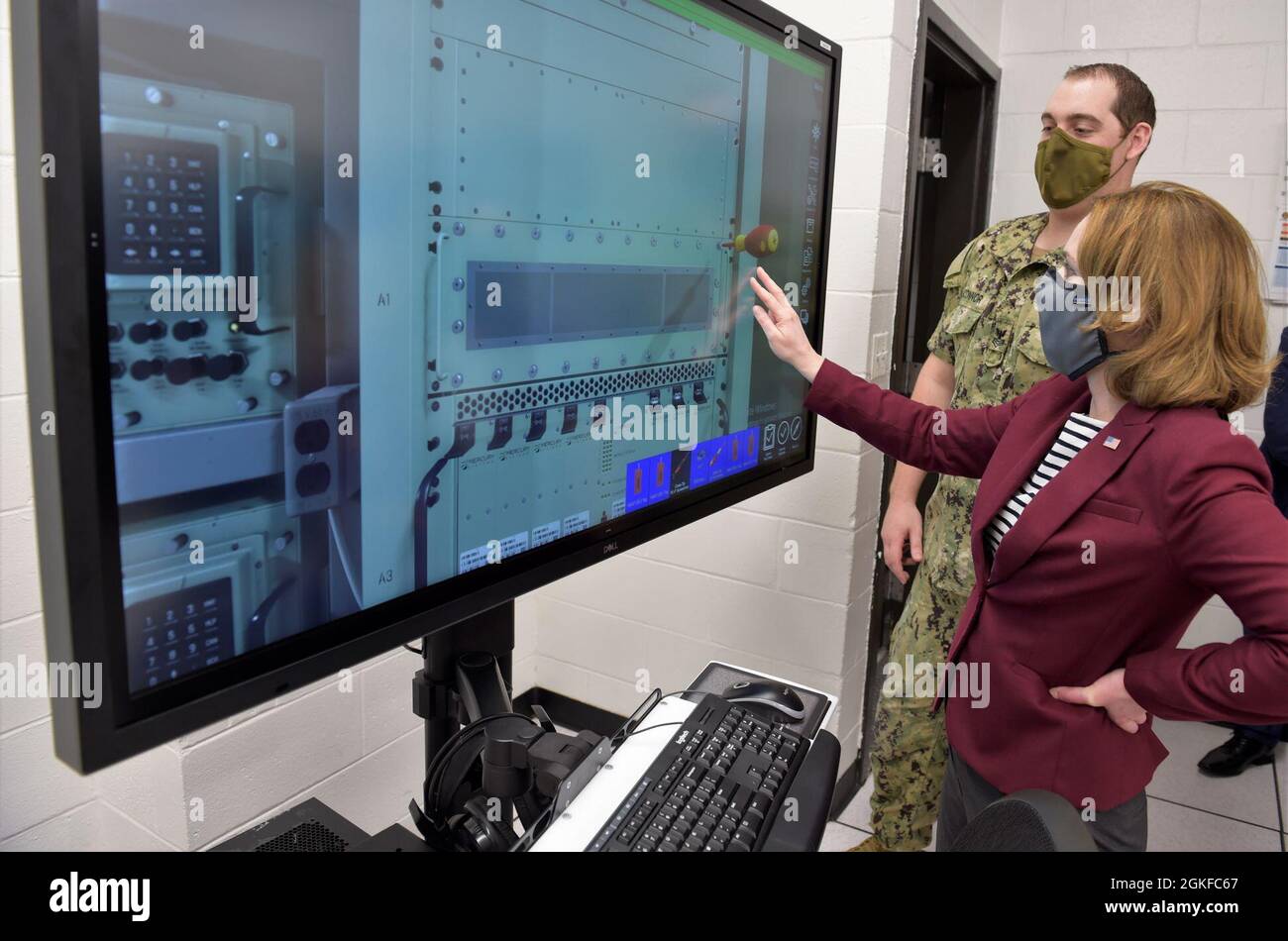 210408-N-XX139-0059 PENSACOLA, Fla. (April 8, 2020) Deputy Secretary of Defense Kathleen H. Hicks participates in a Multipurpose Reconfigurable Training System 3D® (MRTS 3D®) technology training device demonstration and discussion with staff at the Center for Information Warfare Training and Information Warfare Training Command (IWTC) Corry Station. Hicks, along with members of her staff, visited for a familiarization brief and tour of CIWT and IWTC Corry Station onboard Naval Air Station Pensacola Corry Station, Pensacola, Florida. The visit offered an opportunity to update them on CIWT / IWT Stock Photo