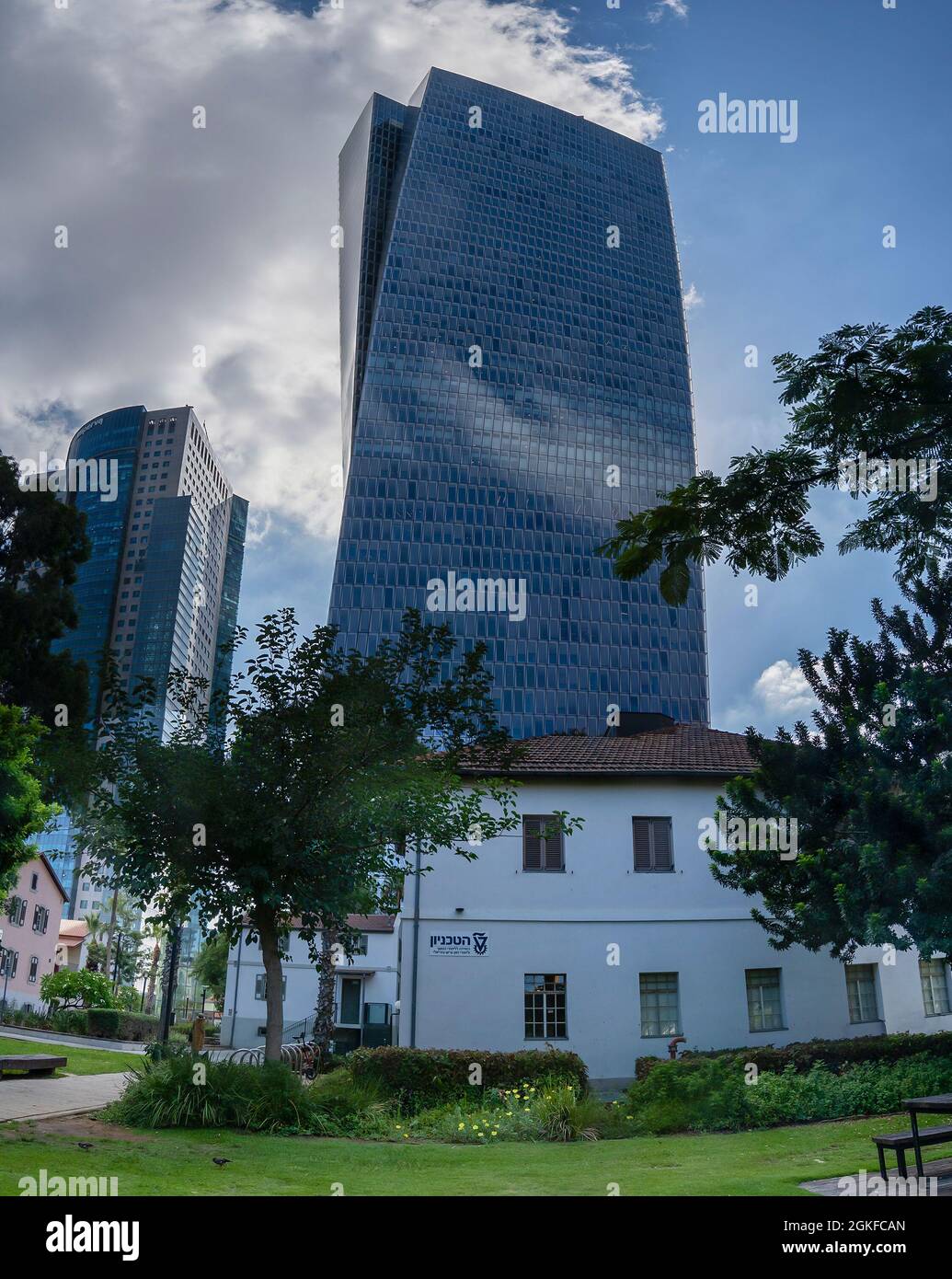 Tel Aviv, Israel - August 19th, 2021:High risers next to renovated old buildings in the Sarona site in Tel Aviv Stock Photo