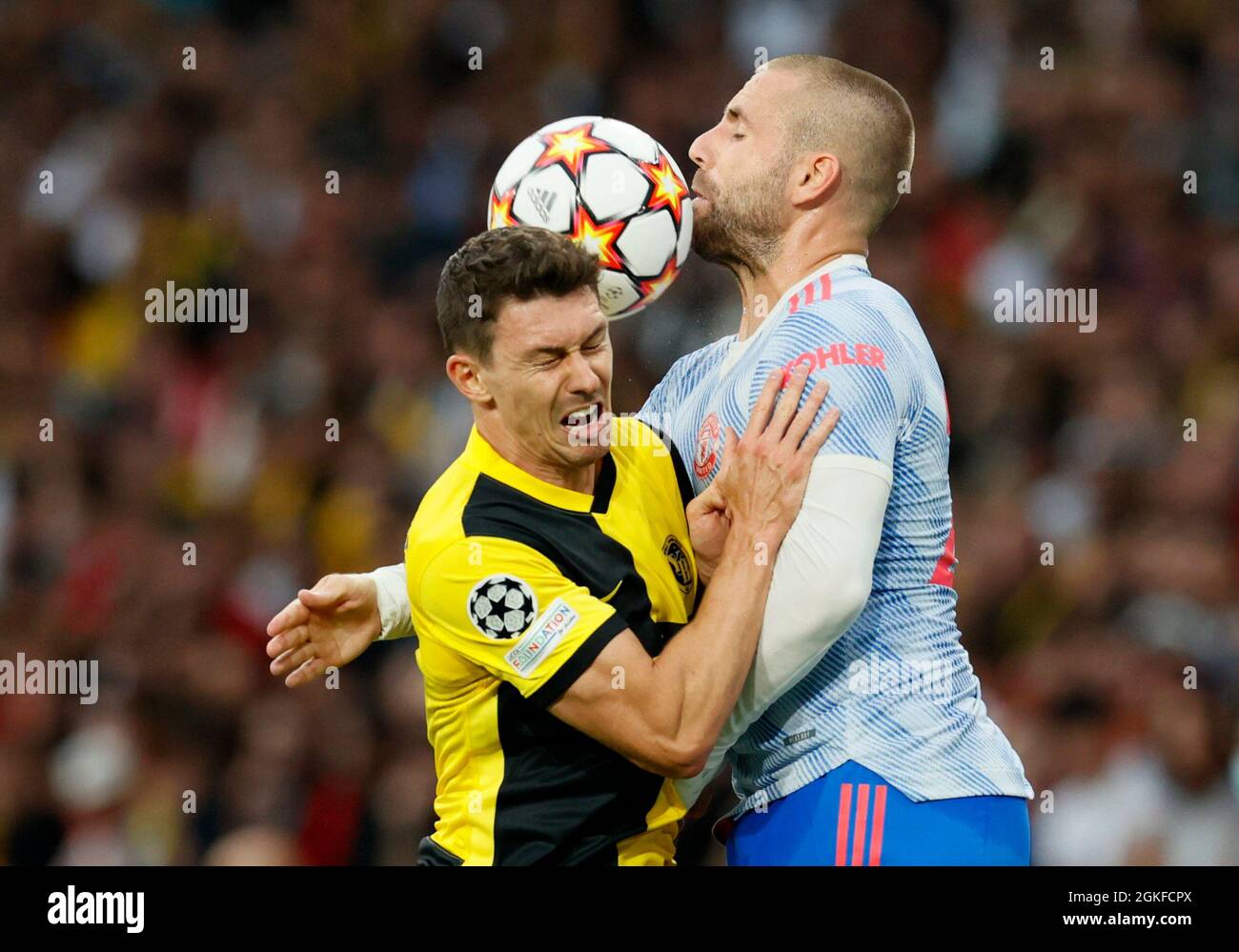 Soccer Football - Champions League - Group F - BSC Young Boys v Manchester United - Stadion Wankdorf, Bern, Switzerland- September 14, 2021 BSC Young Boys' Christian Fassnacht in action with Manchester United's Luke Shaw REUTERS/Denis Balibouse Stock Photo