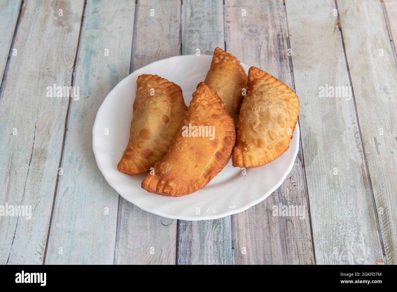 Precooked dough dumplings stuffed with bonito and fried in olive oil