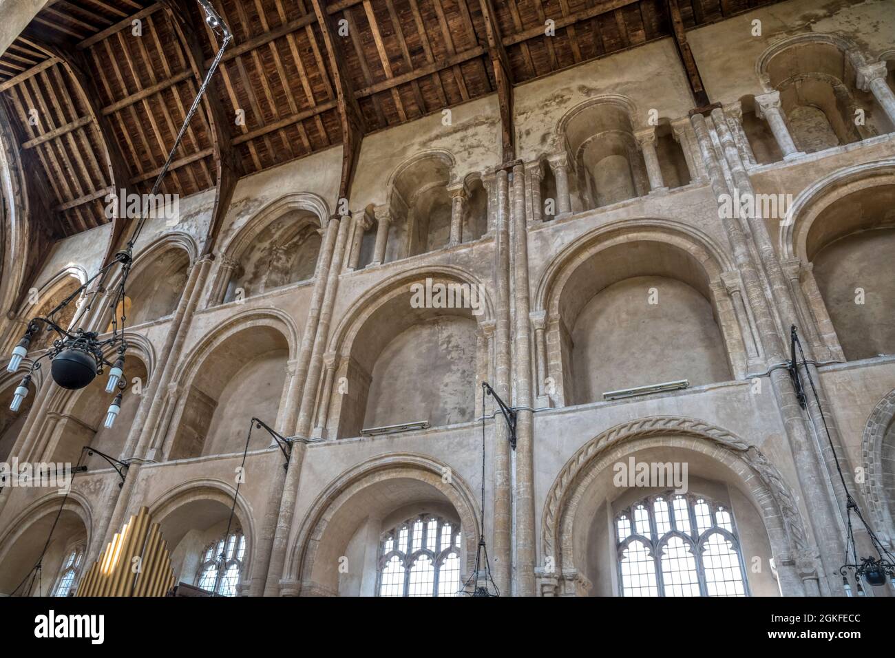 Nave arcades at Binham Priory showing changing architectural styles from Norman to Early English, rising diagonally from right to left. Stock Photo
