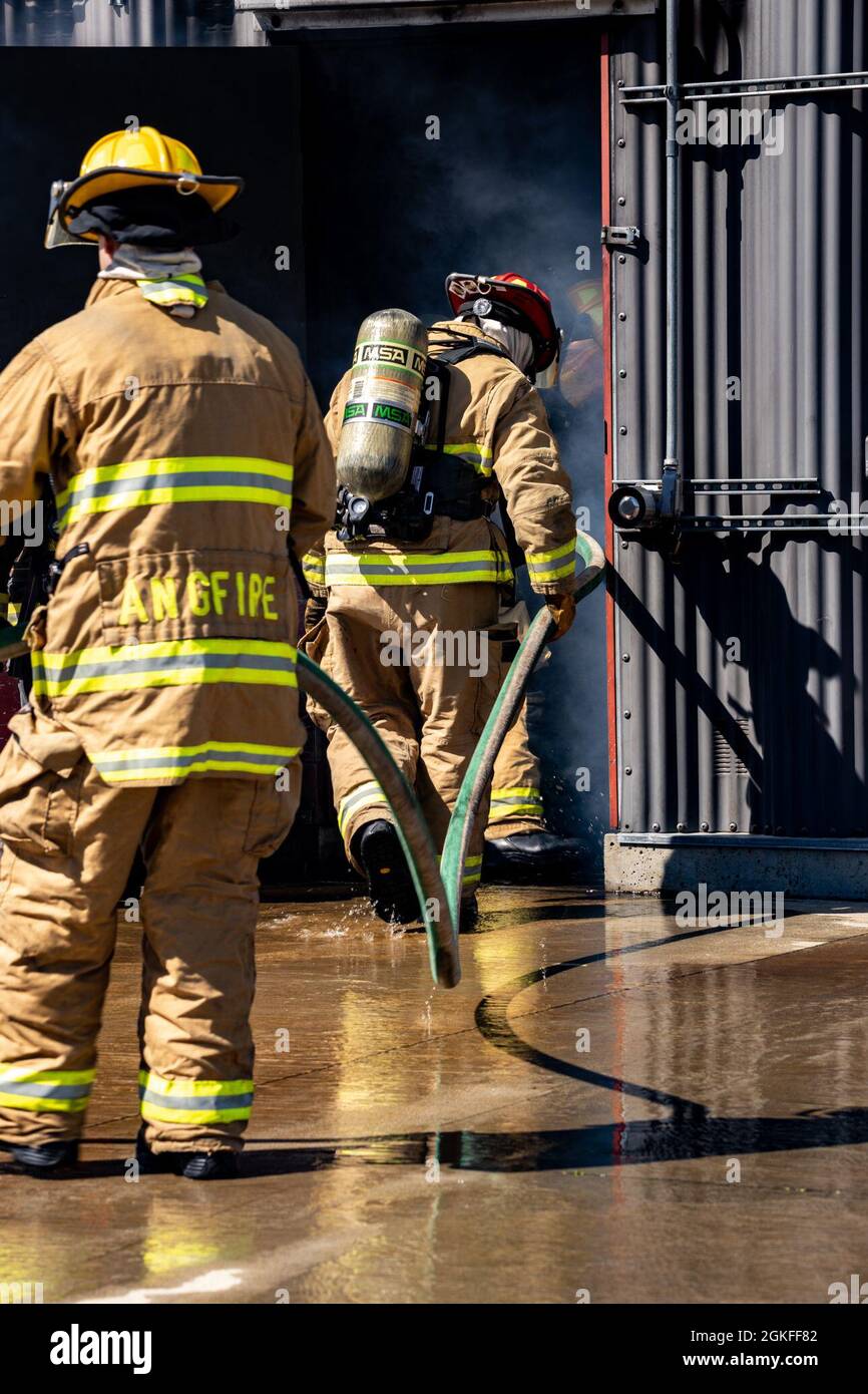 A Team Of Fire Protection Specialists From The 143d Airlift Wing Enter