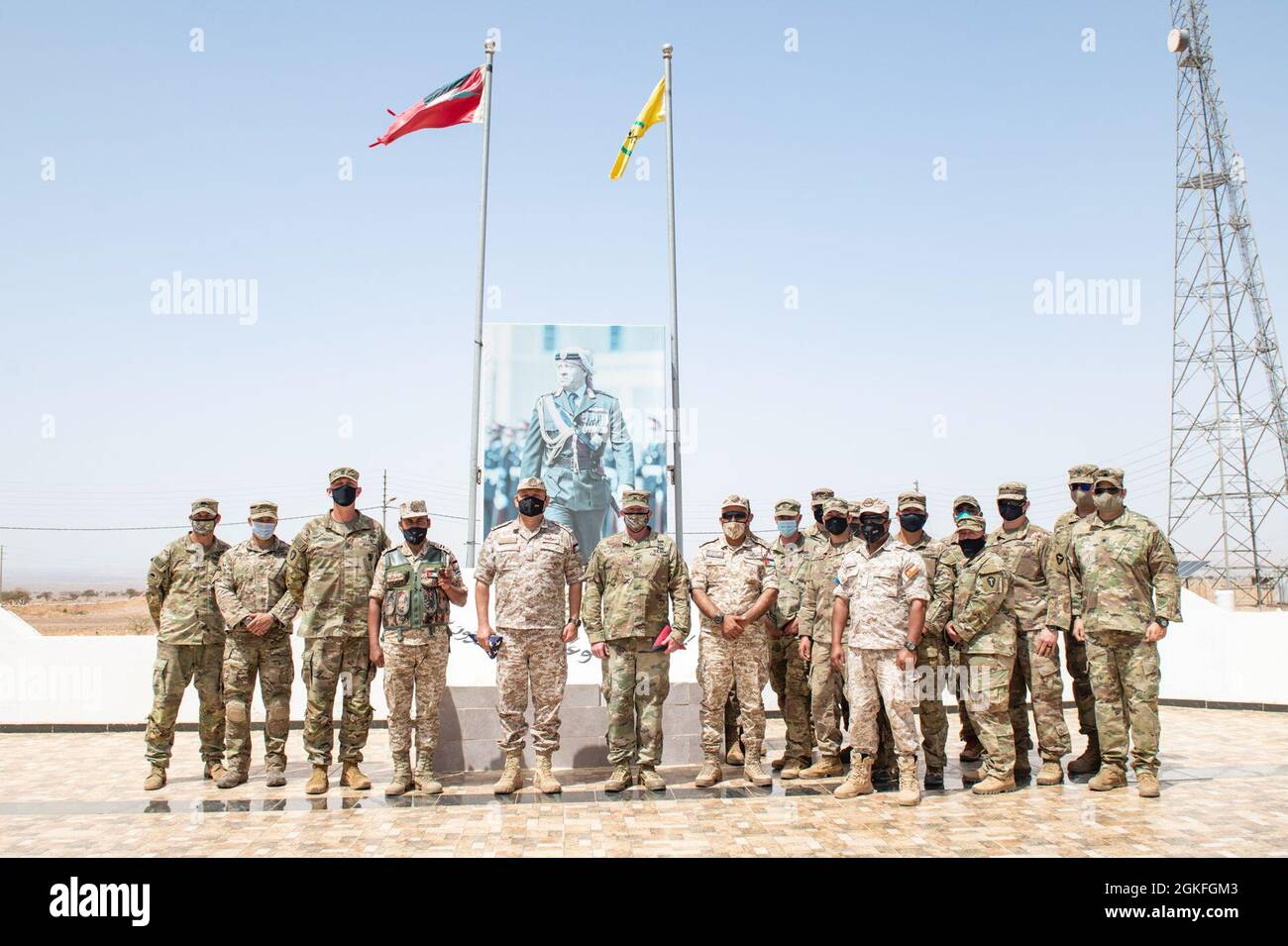 The Jordanian Armed Forces, Southern Command, 3rd Border Guard Group Commander, Col. Ra'ad Al Aamayra, and Task Force Spartan Division Tactical- Jordan Officer in Charge, Col. Christopher Fletcher, exchange flags in a symbolic gesture of friendship and partnership following the successful completion of the Desert Warrior 21 live-fire exercise, April 8, 2021. The exercise was viewed by JAF General Officers and senior leaders from U.S. Army Central and TF Spartan. Moments of expressed gratitude help to solidify the enduring relationship between the two forces. Stock Photo