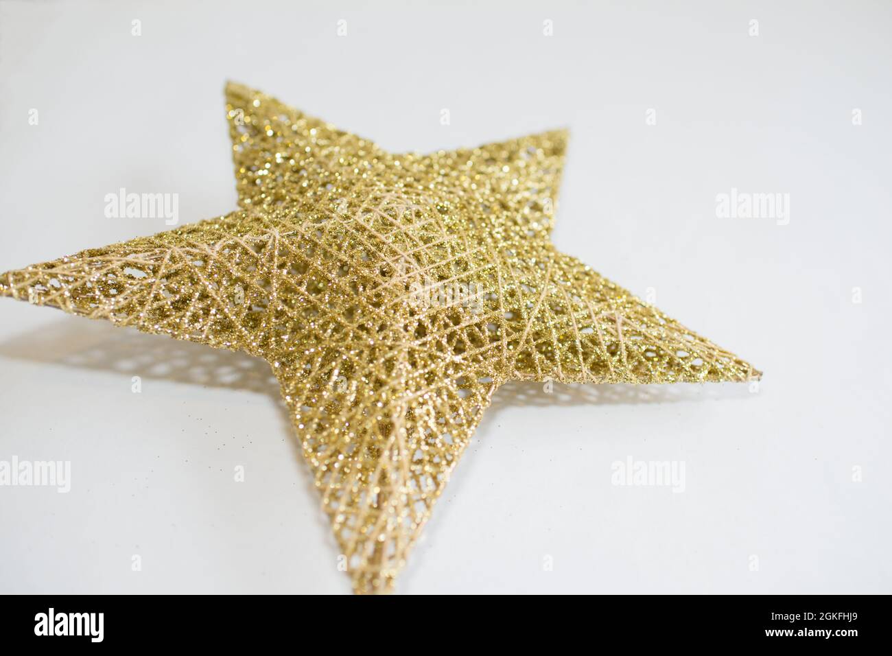 Christmas golden star on a white background Stock Photo - Alamy