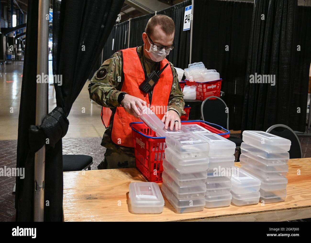 U.S. Air Force 1st Lt. Joseph Hollenbeck, a native of Medway, Massachusetts, and clinical nurse with 88th Surgical Operations Squadron, 88th Air Base Wing stationed at Wright-Patterson Air Force Base, Ohio, prepares vaccines for distribution at the state-run, federally-supported Ford Field Community Vaccination Center in Detroit, April 9, 2021. The Ford Field CVC is designed to vaccinate up to 6,000 community members per day. U.S. Northern Command, through U.S. Army North, remains committed to providing continued, flexible Department of Defense support to the Federal Emergency Management Agenc Stock Photo