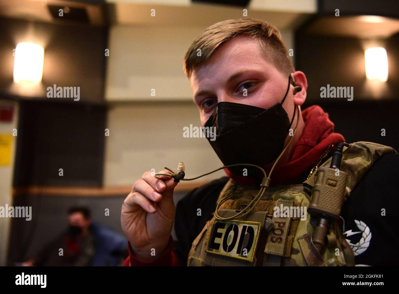 Staff Sgt. Mark White, 8th Civil Engineer Squadron explosive ordnance disposal technician, poses for a photo with an inner ear bone conducting headset during a Wolf Tank at Kunsan Air Base, Republic of Korea, April 9, 2021. Wing leadership funded three of the five ideas that were presented, which included a wireless intercom system, an inner ear bone conducting headset, and hardened aircraft system GPS repeaters. Stock Photo