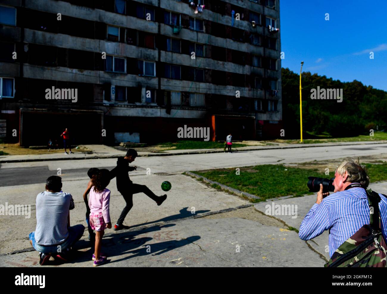 Kosice, Slovakia. 14th Sep, 2021. Local people watch the Pope Francis as he meets local Roma minority at biggest Slovak Roma housing estate Lunik IX in Kosice today, on Tuesday, September 14, 2021, during his four-day visit to Slovakia, which started on Sunday. Credit: Roman Vondrous/CTK Photo/Alamy Live News Stock Photo