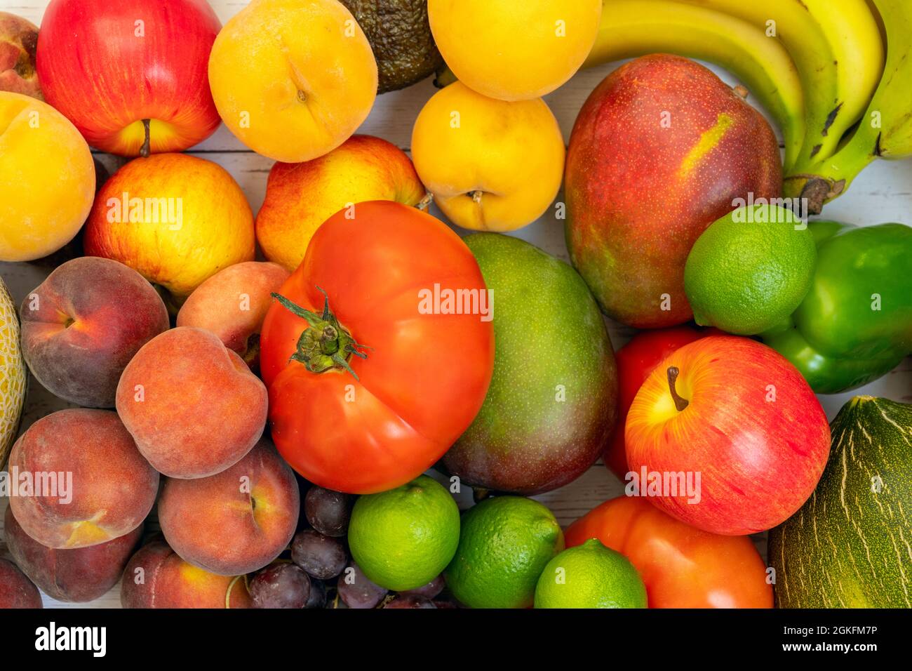 bulk fruits viewed from top view. Apples and limes, yellow peach trees