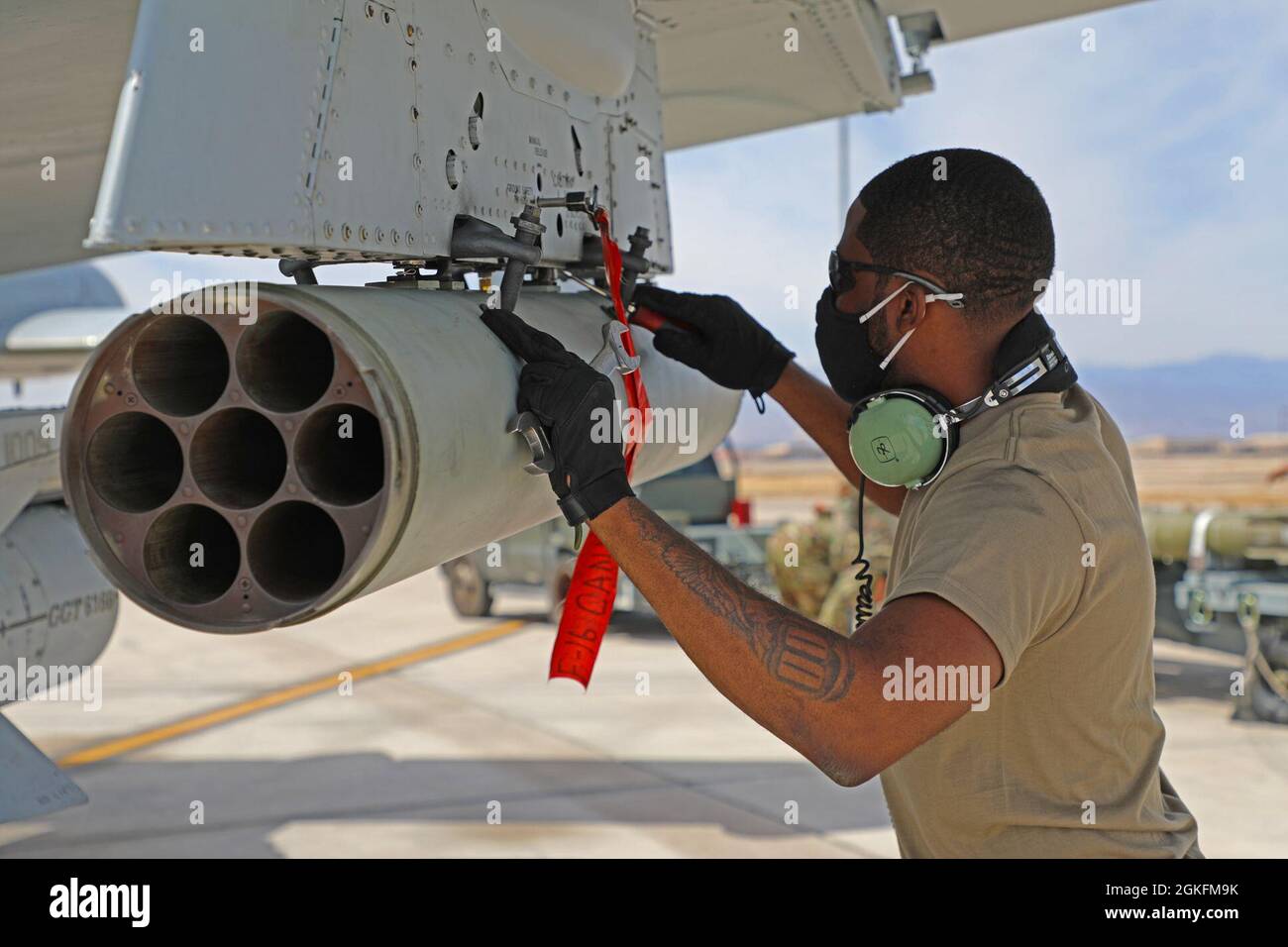 Master Sgt. Joe Mack, from the 127th Wing Maintenance Group, loads rockets on to an A-10 Thunderbolt II at Nellis Air Force Base, Nev., April 9, 2021. Airmen from the 127th Wing are participating in Green Flag, a Joint Force combat exercise, to ensure maximum combat readiness. Stock Photo