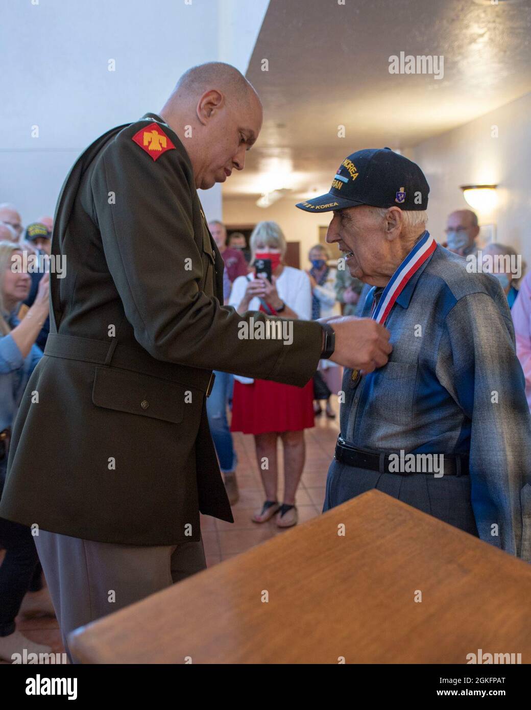 Maj. Gen. Michael Thompson, adjutant general for Oklahoma, presents the