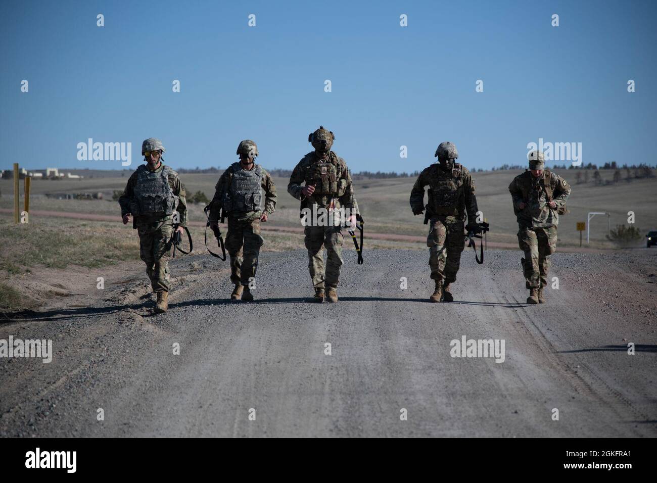 The competitors book it to the ranges after finishing the 6.2 mile ruck ...