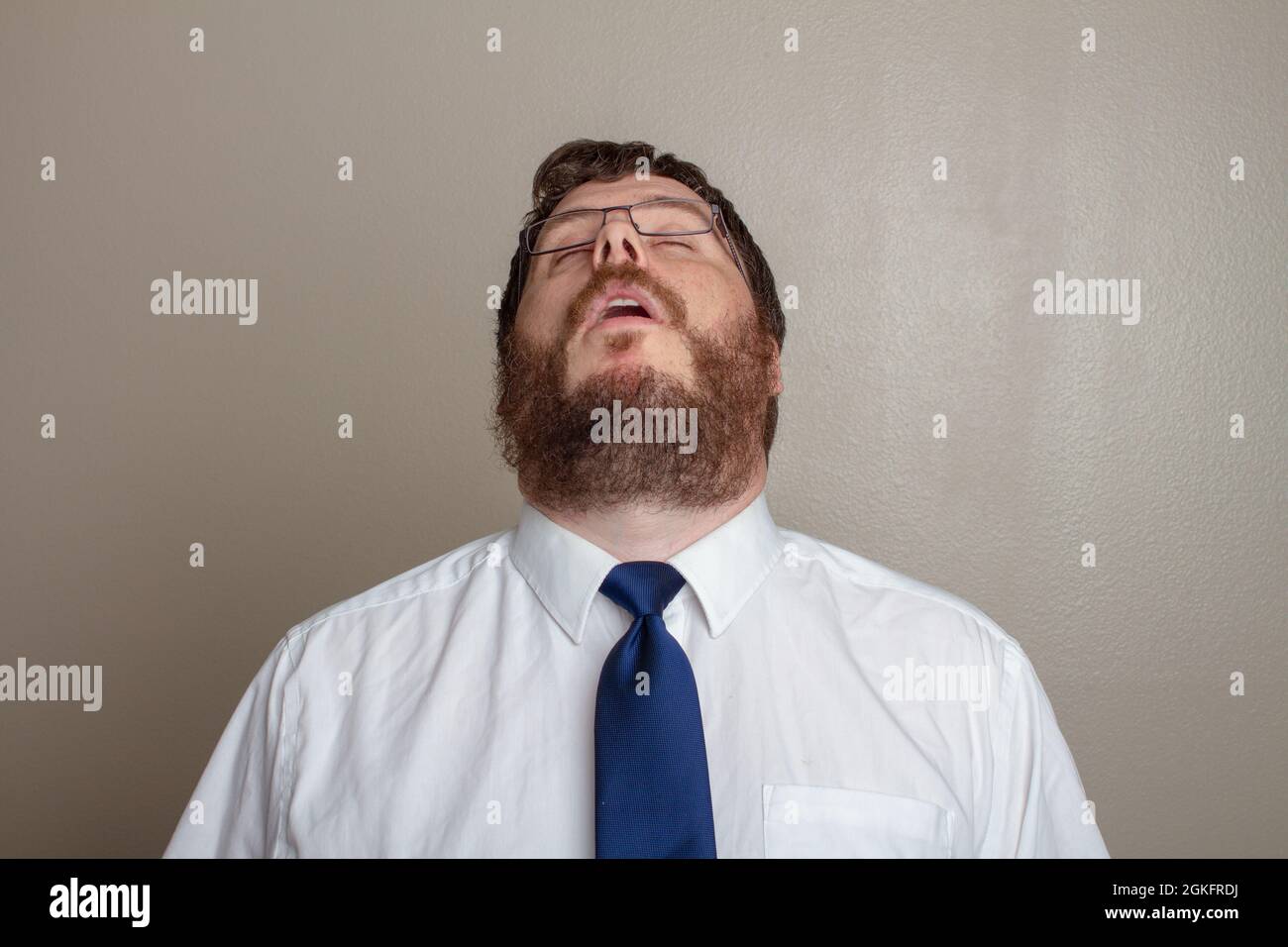 bored man in a dress up shirt Stock Photo