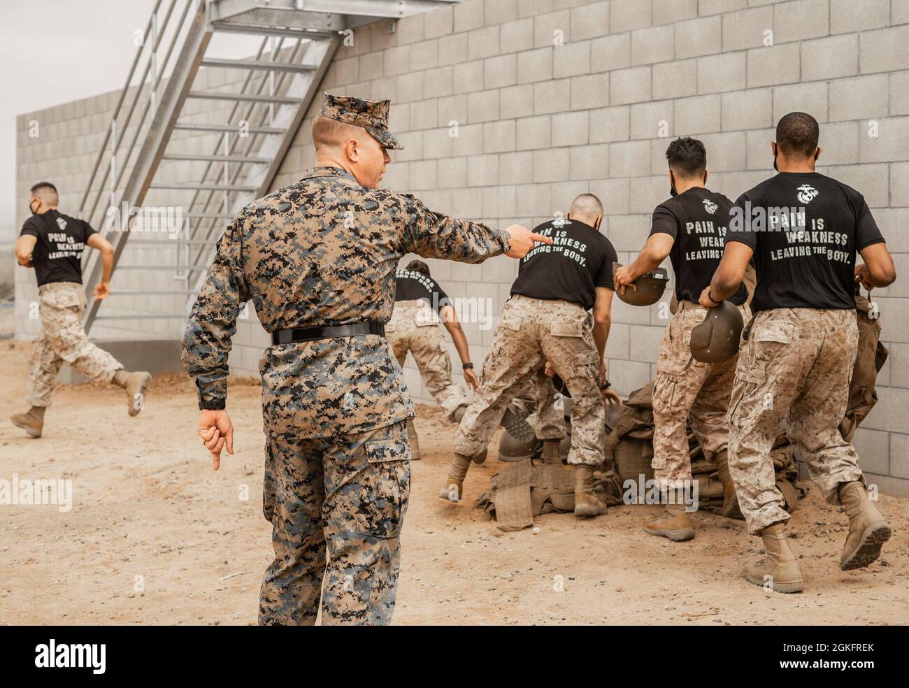 U.S. Marine Corps Staff Sgt. Dylan Williams, a senior drill instructor with  Mike Company, 3rd Recruit Training Battalion, instructs officer candidates  with Recruiting Station Riverside, 12th Marine Corps District, to stage gear