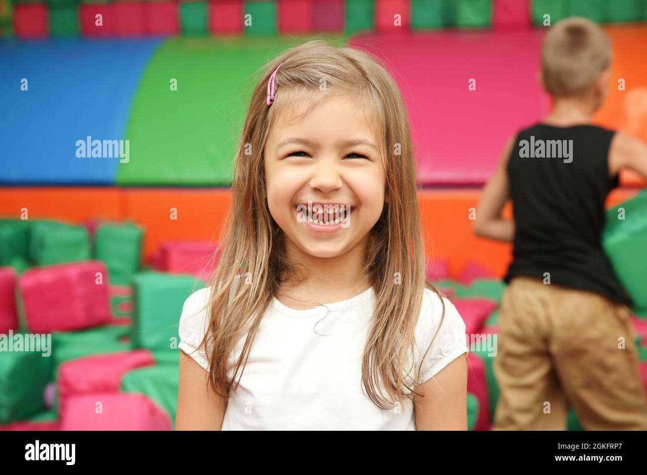 Cute girl in entertainment center Stock Photo Alamy