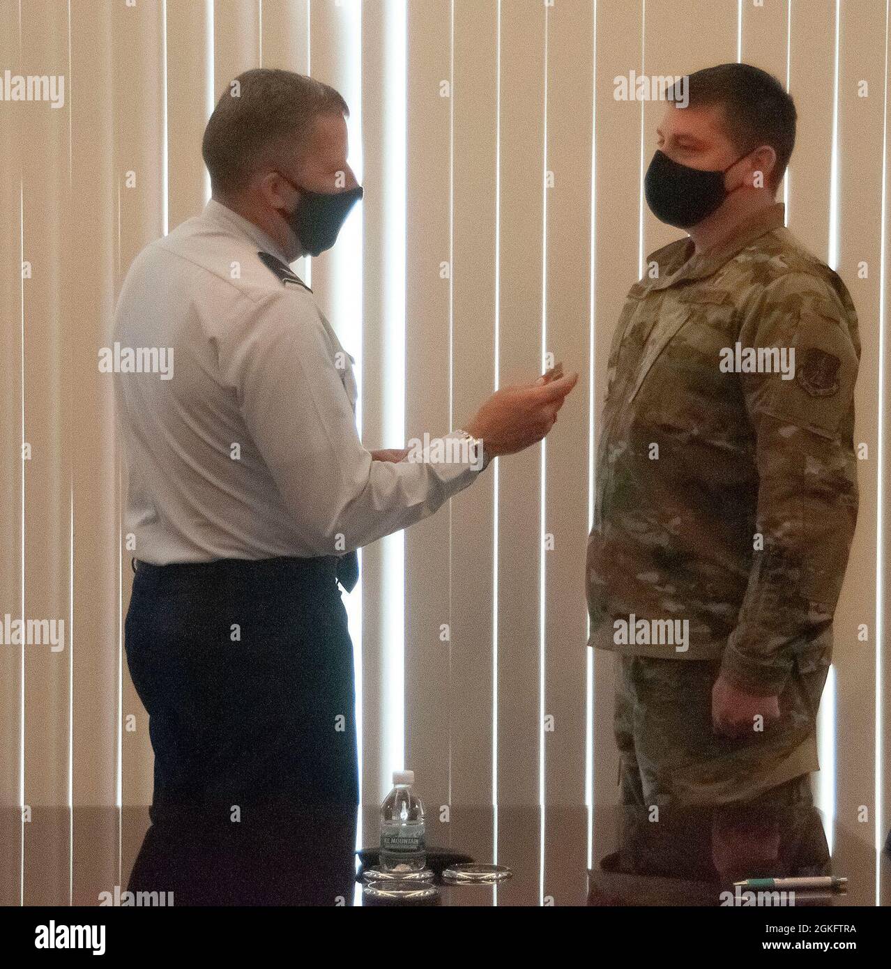 U.S. Air Force Maj. Ryan McDaniel, a chaplain with the 126th Air Refueling Wing, receives his promotion to major from 126th Air Refueling Wing commander, Col. Tom Jackson. The Illinois Air National Guard wing is located at Scott Air Force Base, Ill. Stock Photo