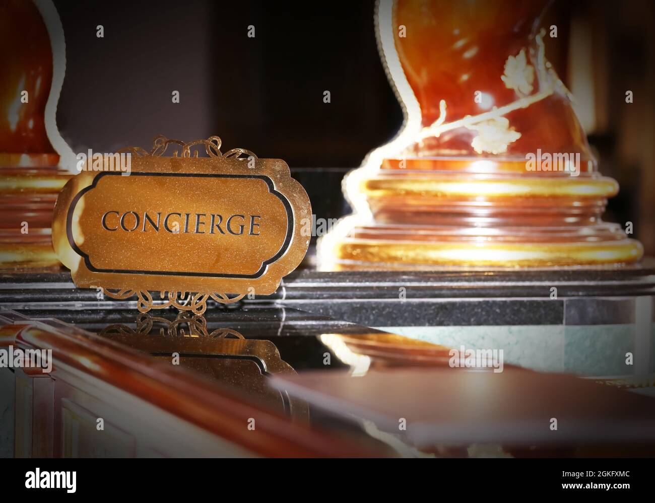 Concierge sign on reception desk in hotel Stock Photo - Alamy