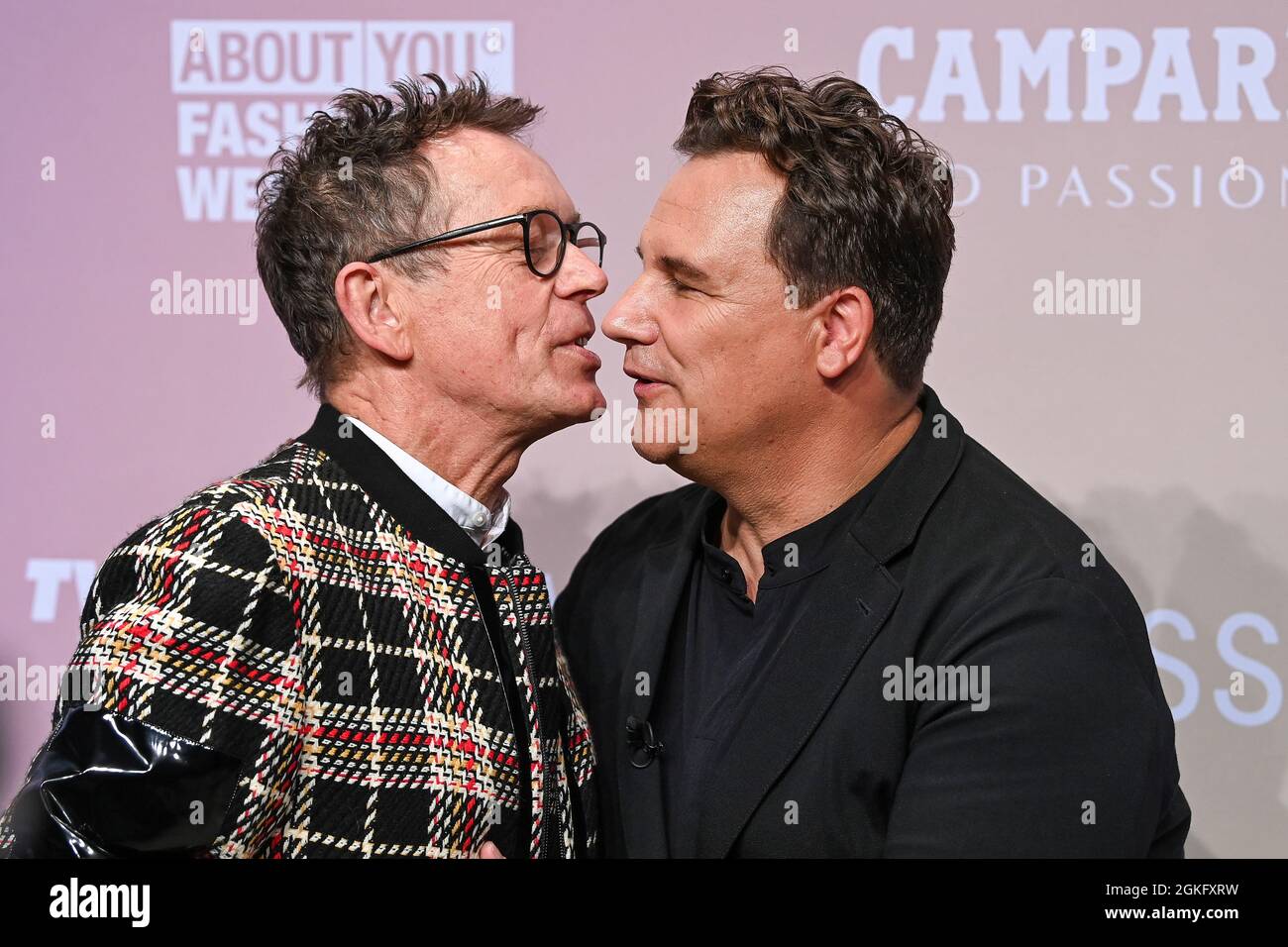 Berlin, Germany. 14th Sep, 2021. Frank Mutters (l) and husband Guido Maria Kretschmer arrive at the Guido Maria Kretschmer show at Kraftwerk. About You, or Re-Fashion Week, has been part of Berlin Fashion Week since 2021. About You Fashion Week runs from 11 to 15 September 2021. Credit: Jens Kalaene/dpa/Alamy Live News Stock Photo