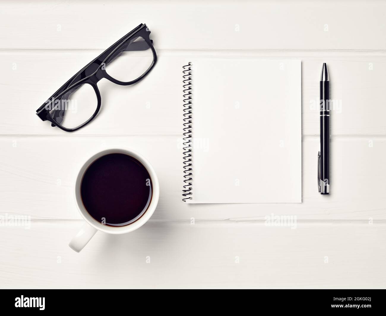 Blank paper notebook with pencil and cup of coffee on wooden table. Stock  Photo #86741320