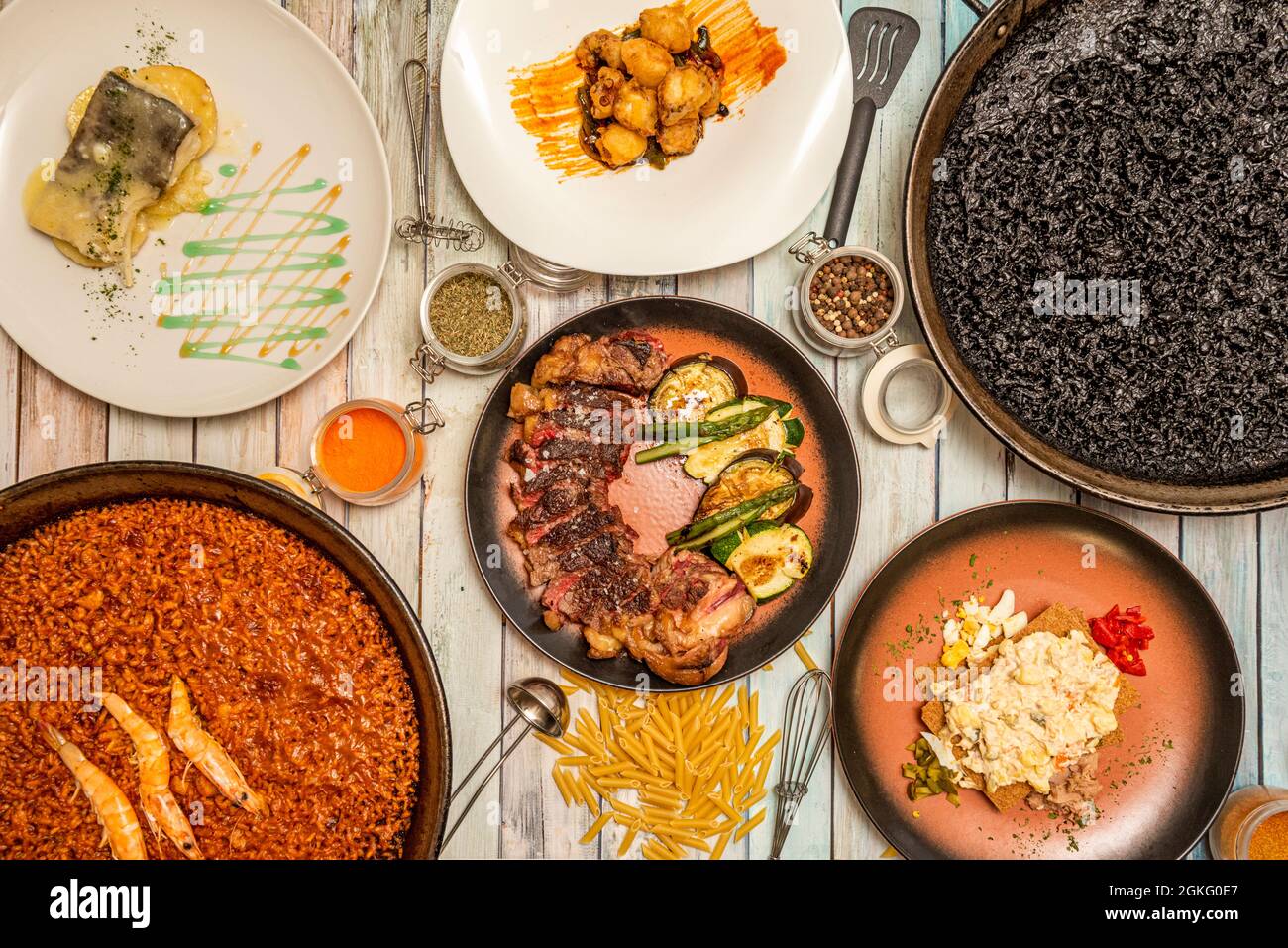 Top view image of Spanish dishes and paellas. Seafood paella, black