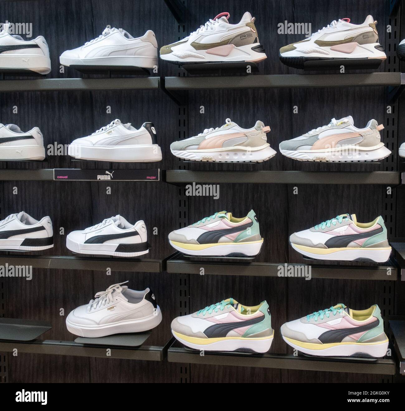 Puma trainers, training shoes store display Stock Photo - Alamy