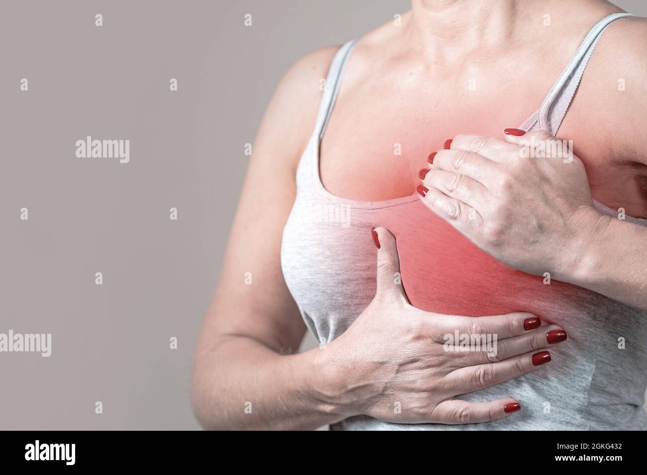 The young woman clutched her sternum. Angina attack, heart disease Stock Photo