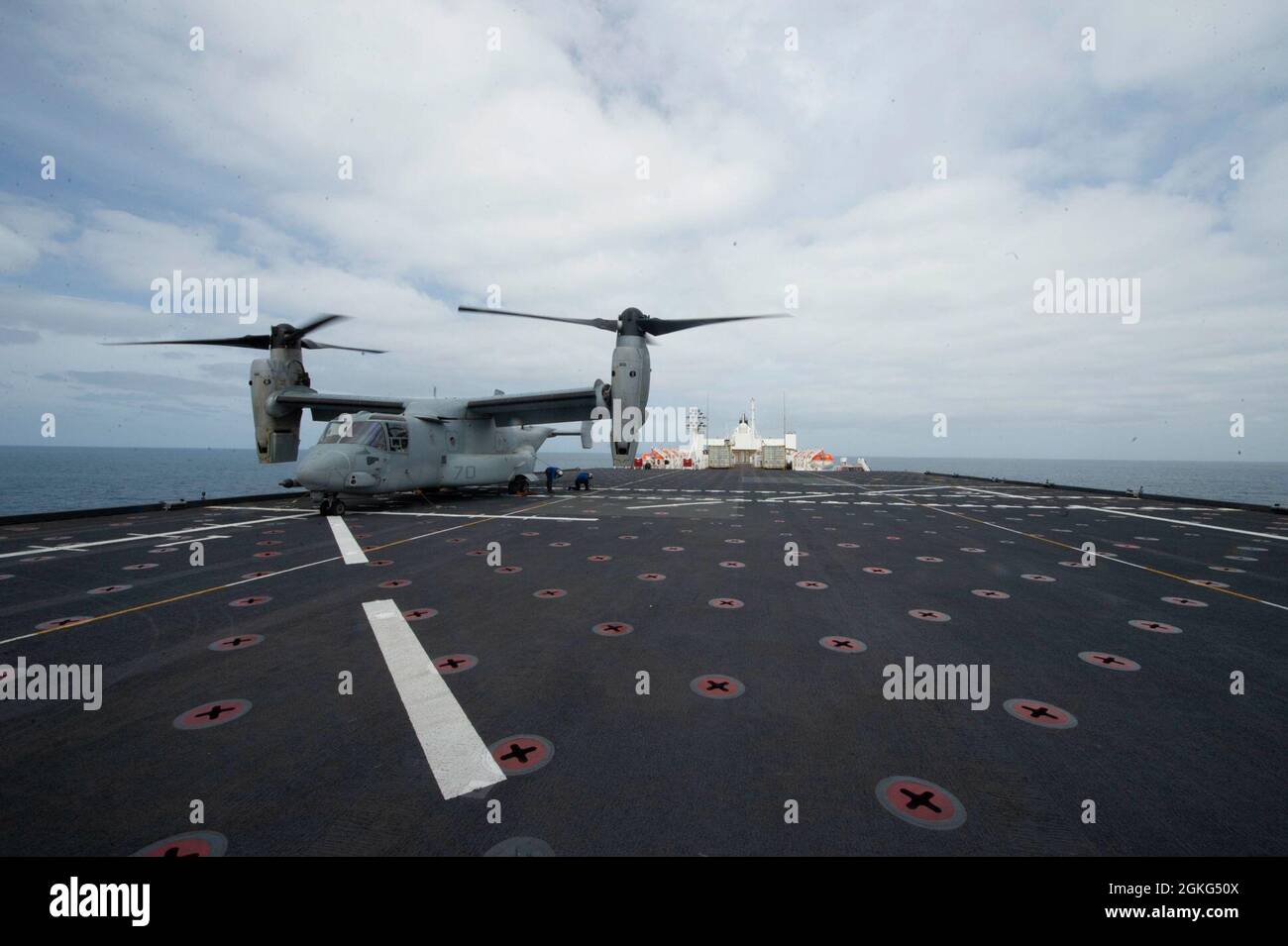 210414-N-LW757-1174  PACIFIC OCEAN (Apr. 14, 2021) Sailors aboard Military Sealift Command hospital ship USNS Mercy (T-AH 19) tie down an MV-22B Osprey assigned to Air Test and Evaluation (HX) Squadron 21 of Naval Air Station (NAS) Patuxent River, Md. on the ship’s flight deck Apr. 14. Mercy is underway off the coast of Southern California completing Dynamic Interface  testing, where the ship’s aviation facilities will be evaluated for compatibility with the V-22 Osprey and MH-60 Seahawk, and establish launch and recovery windows in adverse weather conditions. Mercy recently returned to its ho Stock Photo