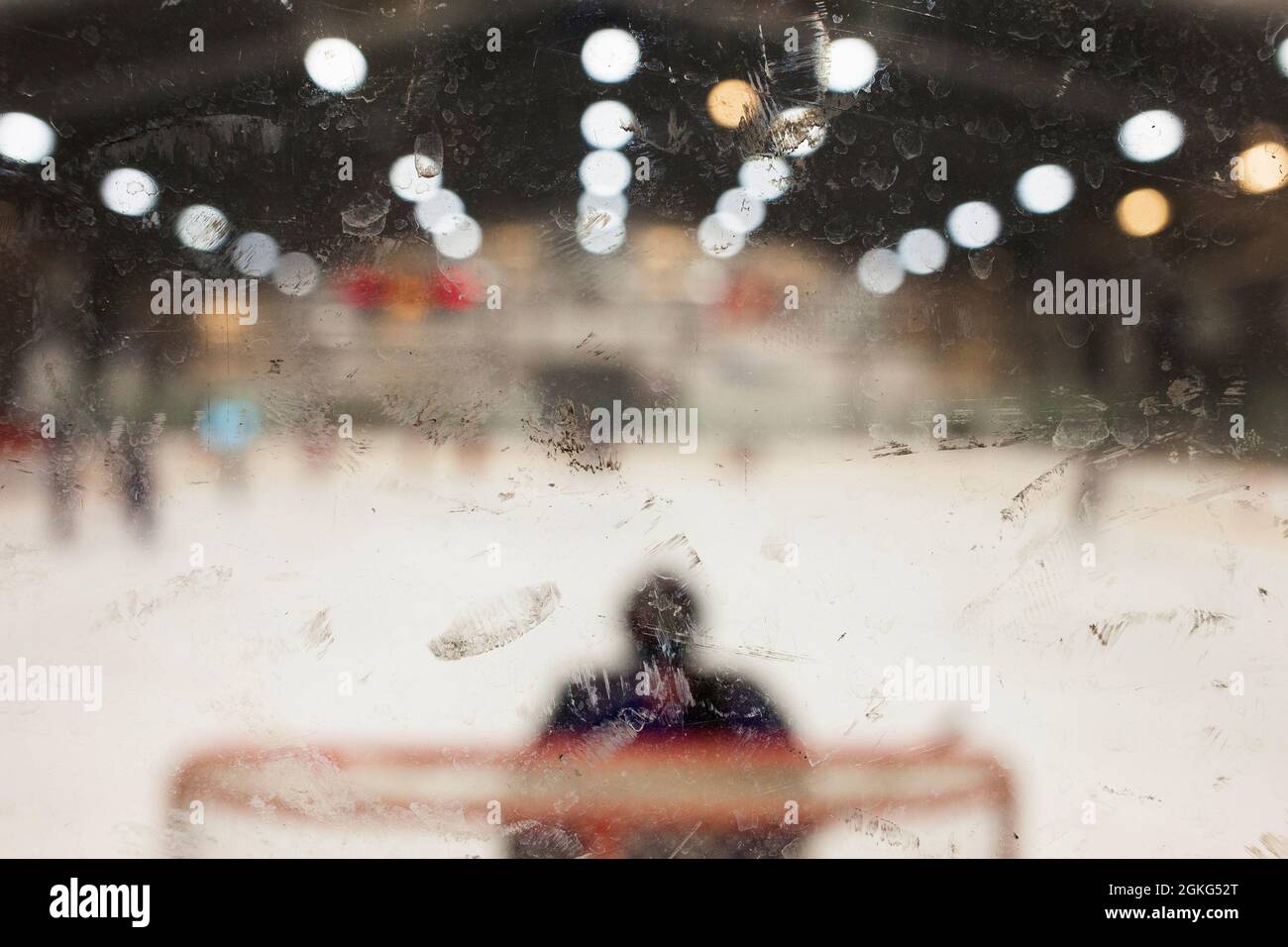 Hockey goalie and puck marks on plexiglass, Fraser Valley BC Canada Stock Photo
