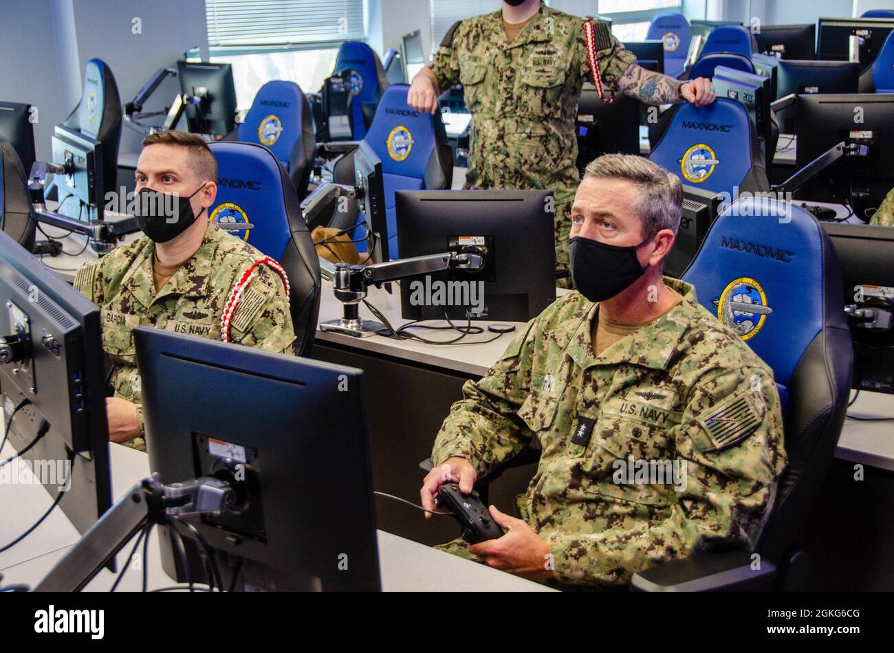 Rear Adm. Peter Garvin, Commander, Naval Education and Training Command, receives a