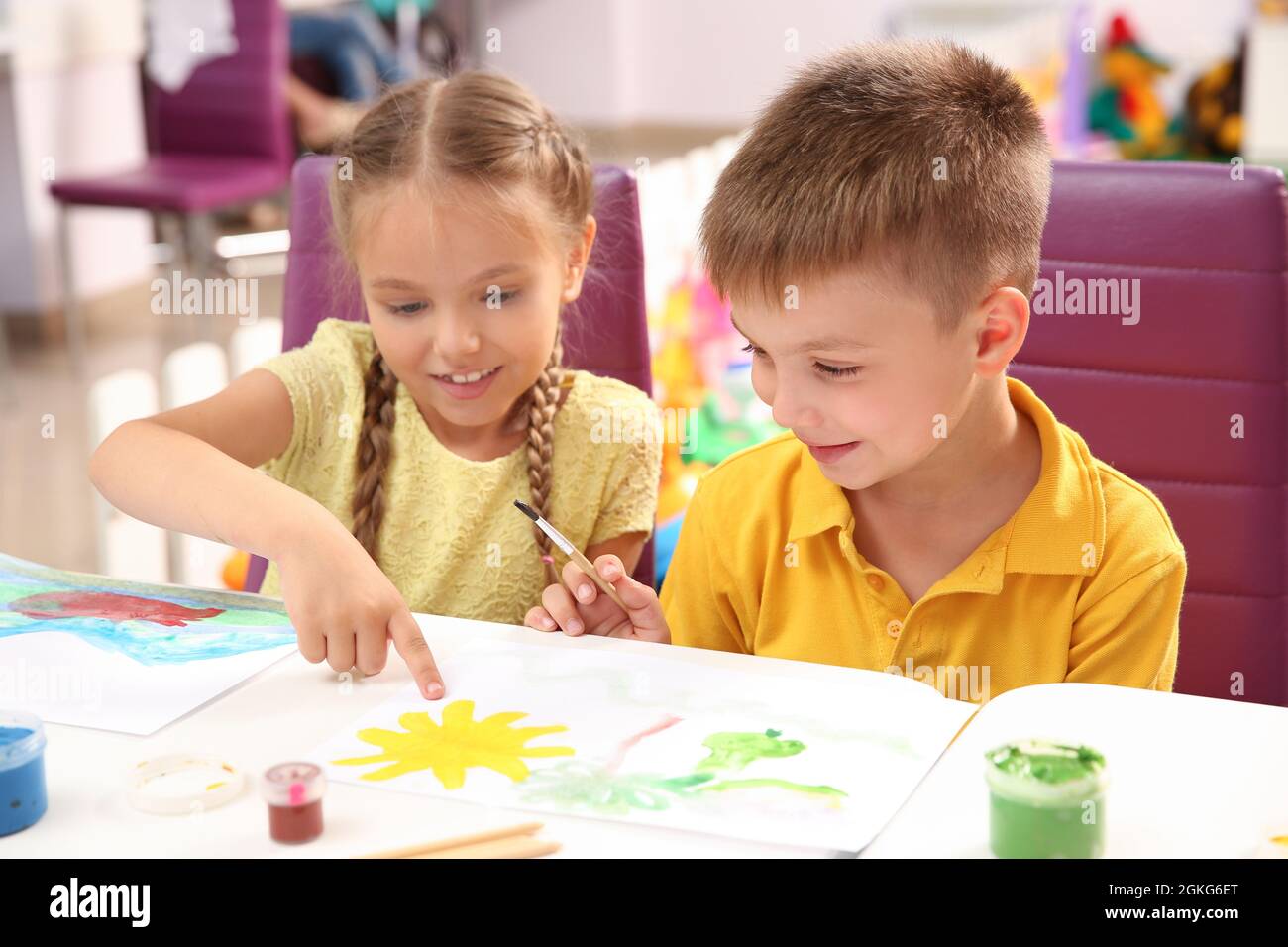 Children at painting lesson in classroom Stock Photo - Alamy