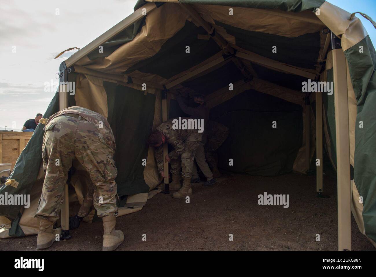 Airmen from the 635th Materiel Maintenance Squadron build a collective ...