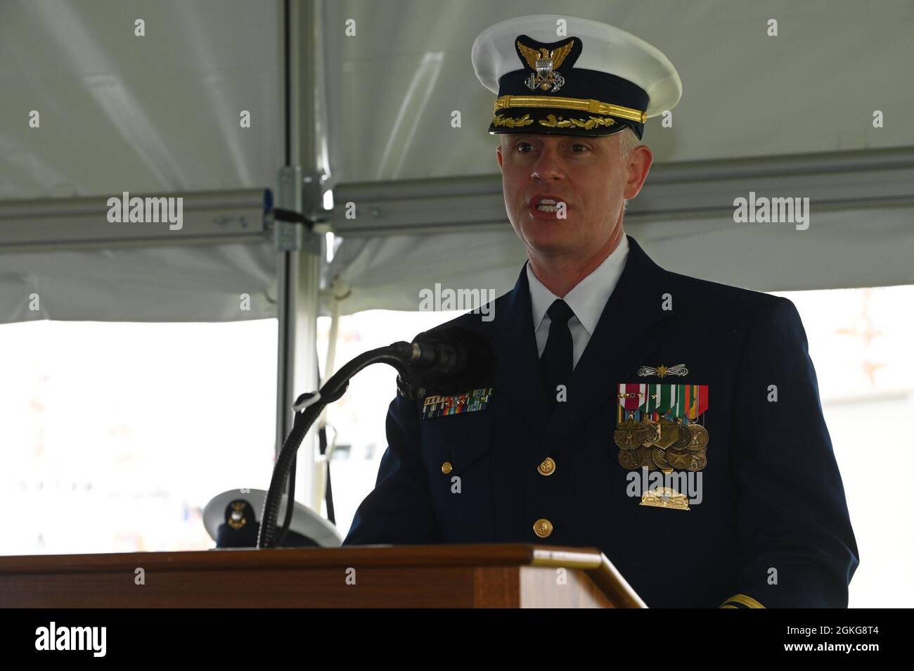 Capt. Jonathan Theel, Commanding Officer of Coast Guard Sector Delaware Bay, addresses the crowd during the official decommissioning ceremony of Coast Guard Cutter Shearwater at Coast Guard Training Center Cape May, New Jersey, April 15, 2021. Coast Guard Cutter Shearwater was the 49th vessel of the Marine Protector Class of Coast Guard Patrol Boats. Stock Photo