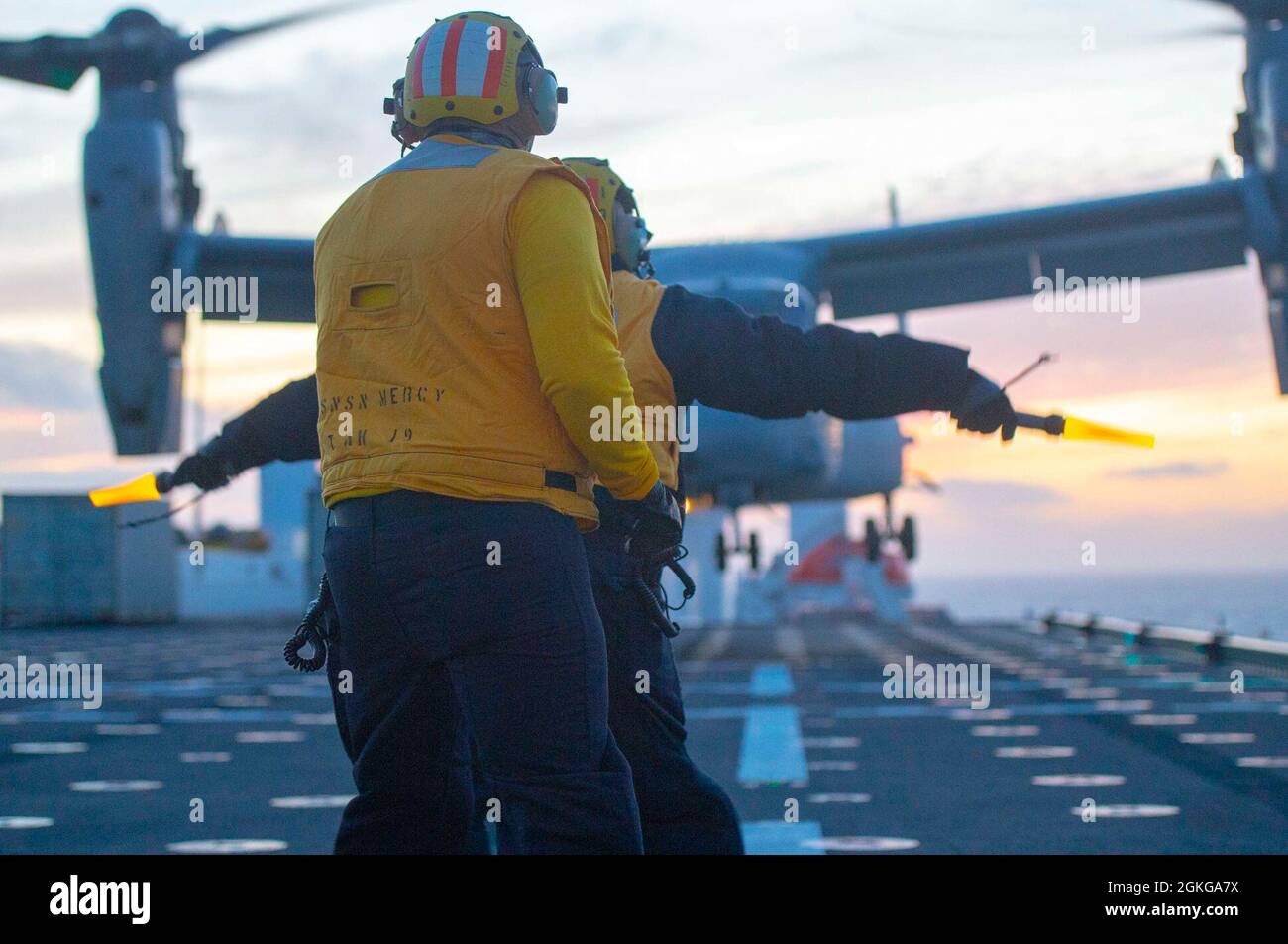 210415-N-LW757-1325  PACIFIC OCEAN (Apr. 15, 2021) Sailors aboard Military Sealift Command hospital ship USNS Mercy (T-AH 19) marshal an MV-22B Osprey assigned to Air Test and Evaluation (HX) Squadron 21 of Naval Air Station (NAS) Patuxent River, Md., on the ship’s flight deck Apr. 15. Mercy is underway off the coast of Southern California completing Dynamic Interface Testing, where the ship’s aviation facilities will be evaluated for compatibility with the V-22 Osprey and MH-60 Seahawk, and establish launch and recovery windows in adverse weather conditions. Mercy recently returned to its hom Stock Photo