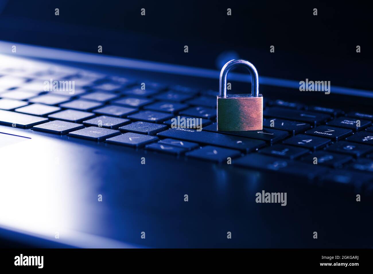 Cybersecurity concept, padlock on laptop computer keyboard. Stock Photo