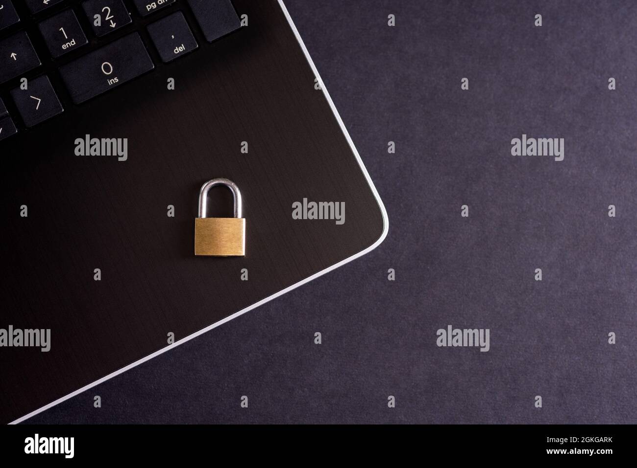 Cybersecurity concept, padlock on laptop computer keyboard. Stock Photo